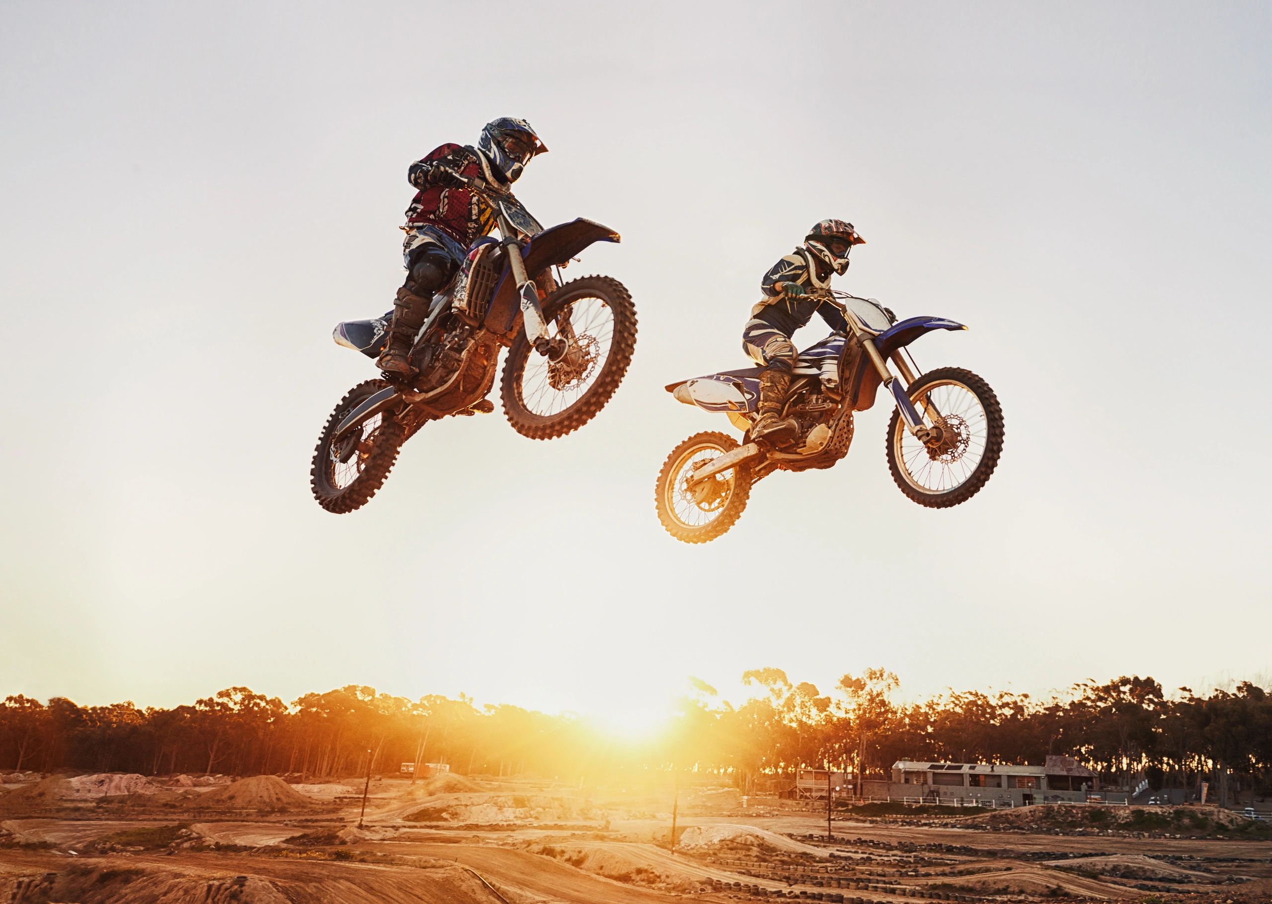 motocross riders in midair